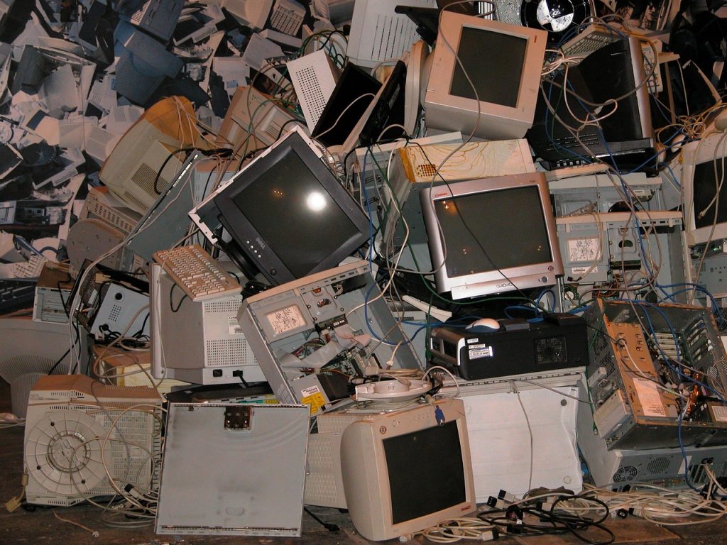 pile of broken crt monitors